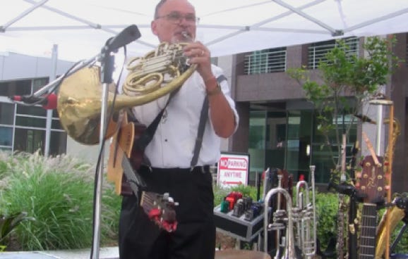 French horn over minor riff.